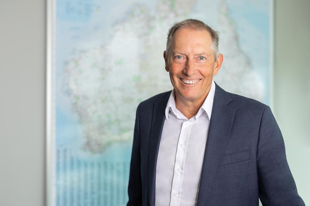 Phil Schacht, CEO of Heidelberg Materials Australia, in front of blue backdrop